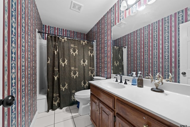 full bathroom featuring vanity, shower / tub combo, tile patterned floors, and toilet