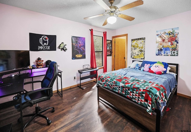 bedroom featuring ceiling fan, a textured ceiling, baseboards, and wood finished floors