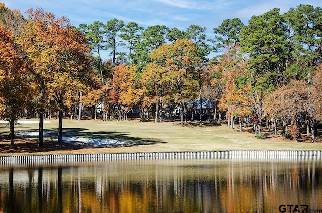 surrounding community featuring a water view