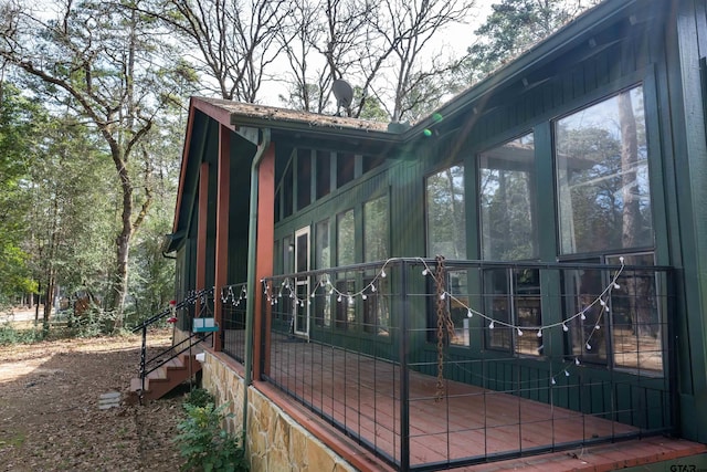 view of side of property with a sunroom