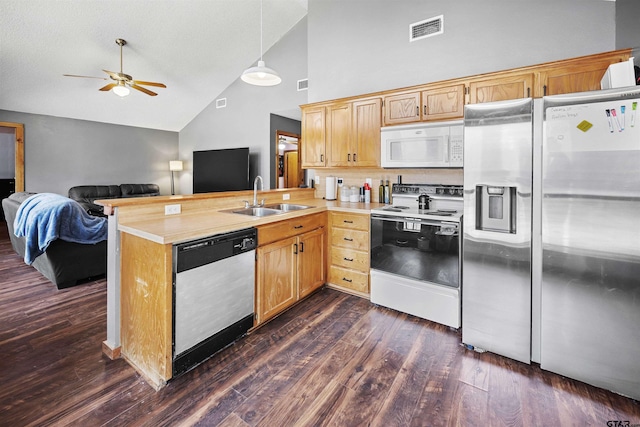 kitchen featuring white microwave, visible vents, electric stove, stainless steel refrigerator with ice dispenser, and dishwasher