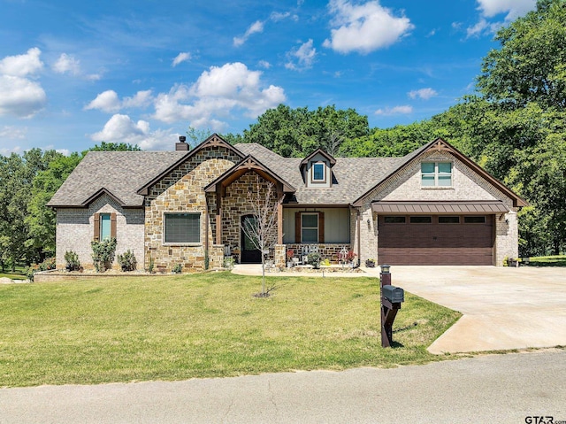 view of front of property with a garage, a front lawn, concrete driveway, and roof with shingles