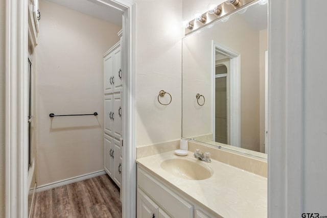 bathroom with vanity and hardwood / wood-style flooring