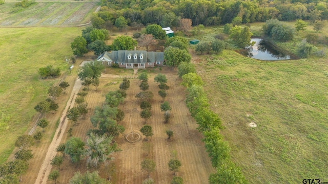 birds eye view of property with a rural view and a water view