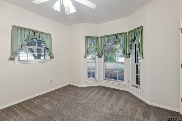 spare room featuring carpet and ceiling fan