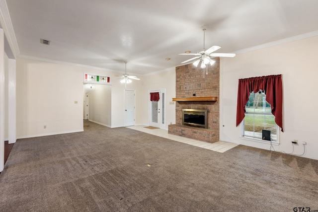 unfurnished living room featuring ceiling fan, light colored carpet, a brick fireplace, and ornamental molding