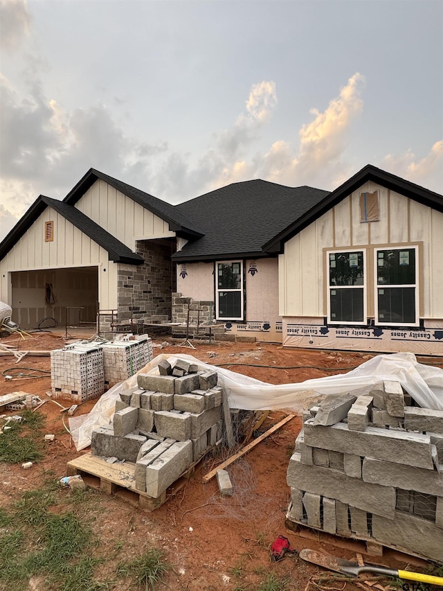 15564 County Road 434, Lindale, TX 75771 - view of front of house with board and batten siding, a shingled roof, and a garage