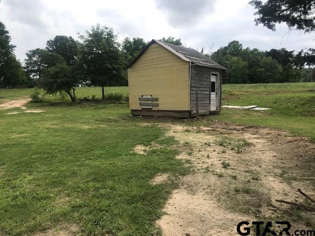 view of outdoor structure with a yard