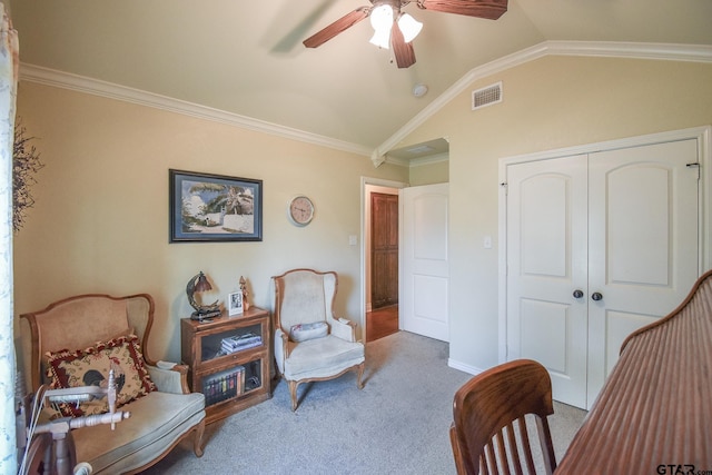 sitting room with carpet, ornamental molding, ceiling fan, and lofted ceiling