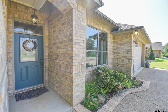 doorway to property featuring a garage