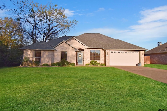 view of front of property with a front lawn and a garage