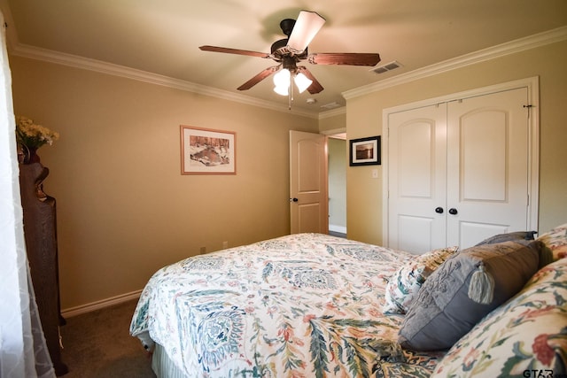 bedroom featuring ceiling fan, a closet, crown molding, and dark colored carpet