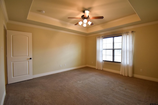 bedroom featuring a tray ceiling, ceiling fan, crown molding, and carpet flooring