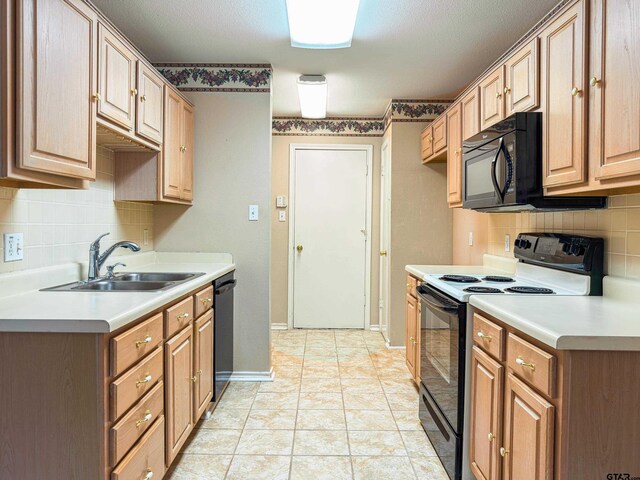 1202 Rice Rd, Road, Tyler, TX 75703 - kitchen with black appliances, a sink, decorative backsplash, and light countertops