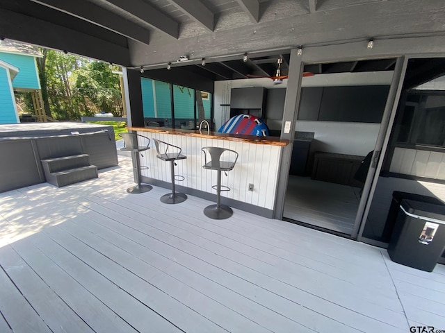 wooden terrace with an outdoor wet bar