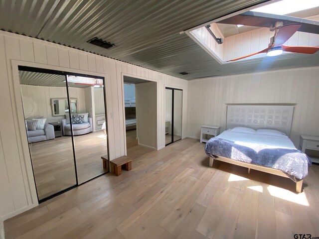 bedroom featuring ceiling fan and light wood-type flooring