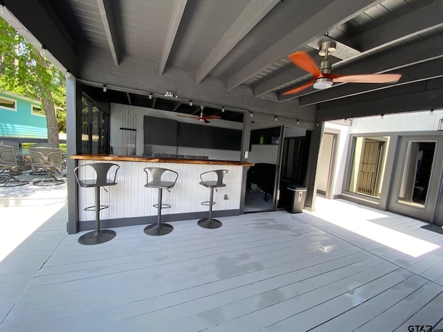 wooden terrace featuring ceiling fan