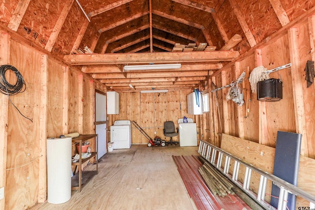 interior space with lofted ceiling and washer / dryer