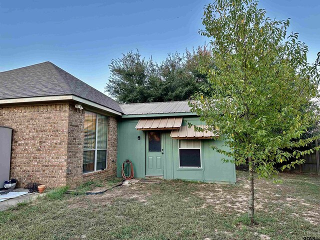 view of home's exterior featuring a lawn