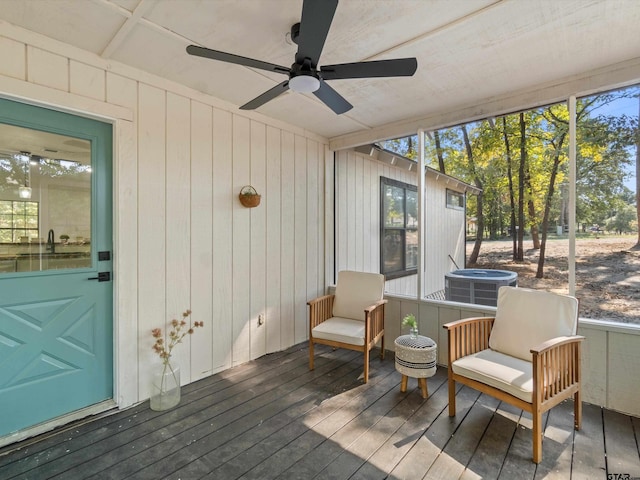 sunroom / solarium with plenty of natural light and ceiling fan