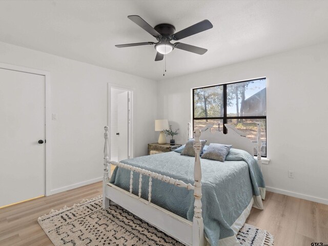 bedroom featuring ceiling fan and light hardwood / wood-style flooring