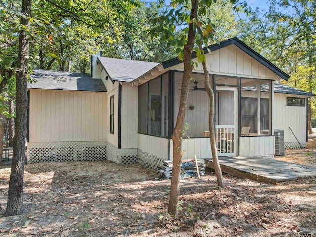 view of front of home with cooling unit and a sunroom