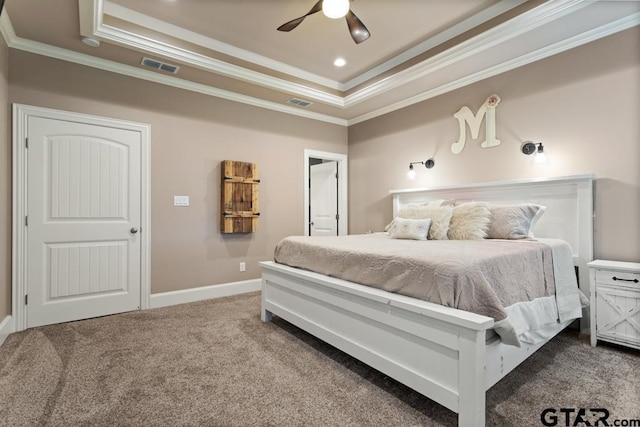 bedroom with carpet flooring, a raised ceiling, ceiling fan, and crown molding