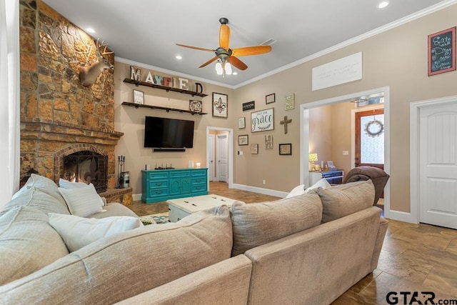 living room with a fireplace, ceiling fan, and ornamental molding