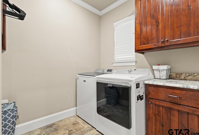 laundry room with cabinets, separate washer and dryer, and ornamental molding