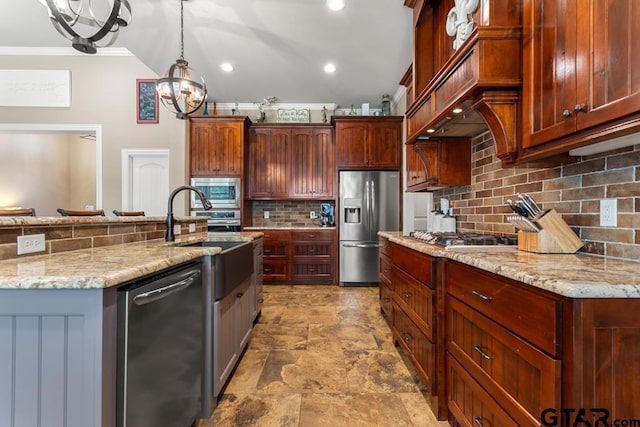 kitchen with backsplash, an inviting chandelier, hanging light fixtures, light stone countertops, and stainless steel appliances