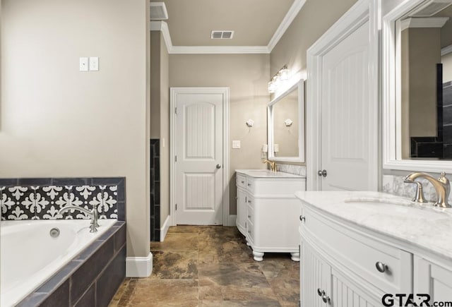 bathroom featuring vanity, ornamental molding, and tiled tub