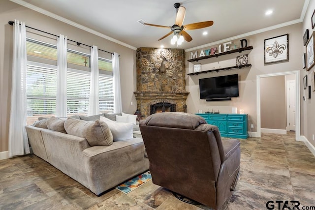 living room featuring ceiling fan, ornamental molding, and a fireplace