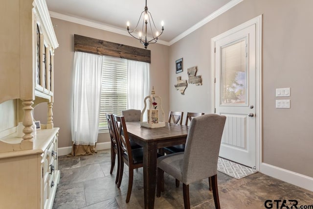 dining area with ornamental molding and a chandelier