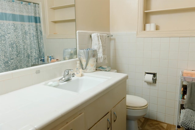 bathroom with parquet flooring, tile walls, and built in features