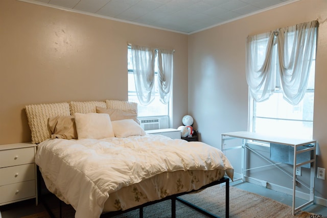 bedroom featuring ornamental molding and cooling unit