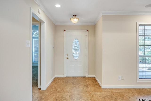 foyer featuring crown molding