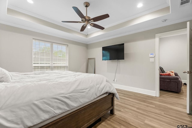 607 Main St, Bullard, TX 75757 - bedroom with a raised ceiling, light wood-style flooring, baseboards, ornamental molding, and recessed lighting