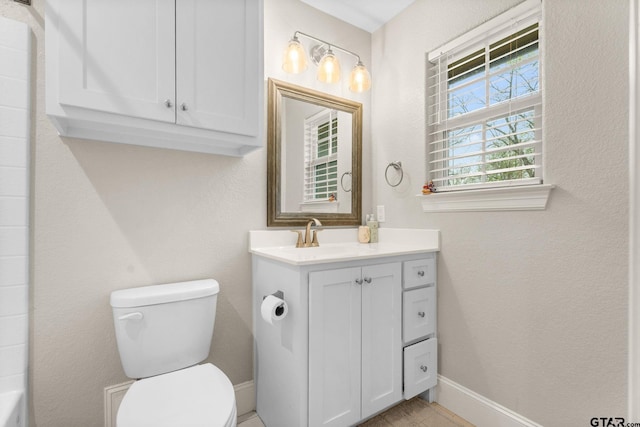 607 Main St, Bullard, TX 75757 - bathroom with toilet, vanity, and baseboards