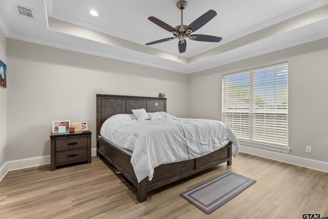 607 Main St, Bullard, TX 75757 - bedroom featuring a raised ceiling, ornamental molding, light wood finished floors, baseboards, and recessed lighting