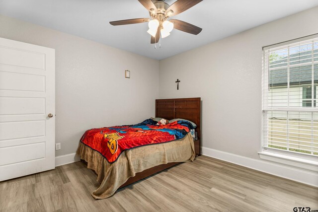 607 Main St, Bullard, TX 75757 - bedroom featuring wood finished floors, baseboards, and a ceiling fan