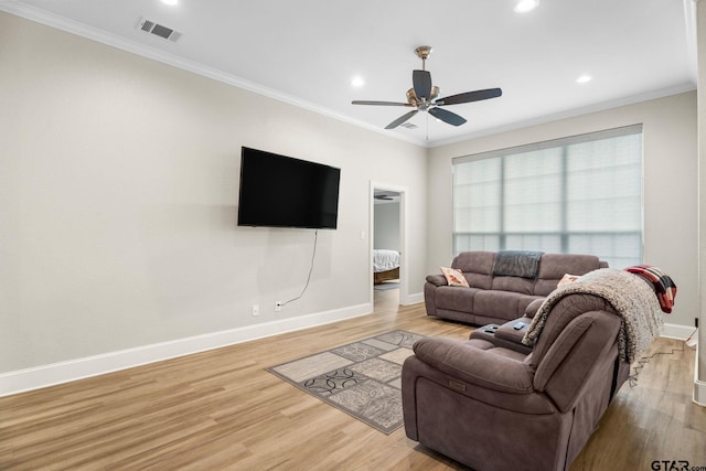 607 Main St, Bullard, TX 75757 - living area featuring light wood-type flooring, baseboards, a ceiling fan, crown molding, and recessed lighting