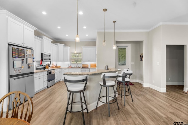 607 Main St, Bullard, TX 75757 - kitchen with appliances with stainless steel finishes, a sink, baseboards, crown molding, and white cabinetry