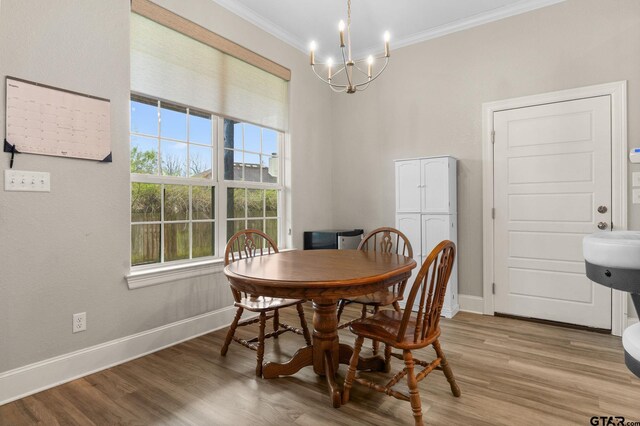 607 Main St, Bullard, TX 75757 - dining space featuring a chandelier, healthy amount of natural light, baseboards, crown molding, and light wood finished floors