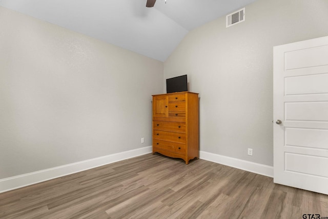 607 Main St, Bullard, TX 75757 - bedroom featuring light wood finished floors, vaulted ceiling, baseboards, and ceiling fan