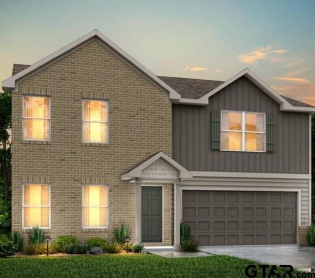 404 Parker Oaks Dr, Chandler, TX 75758 - view of front of house with brick siding, board and batten siding, a garage, and driveway