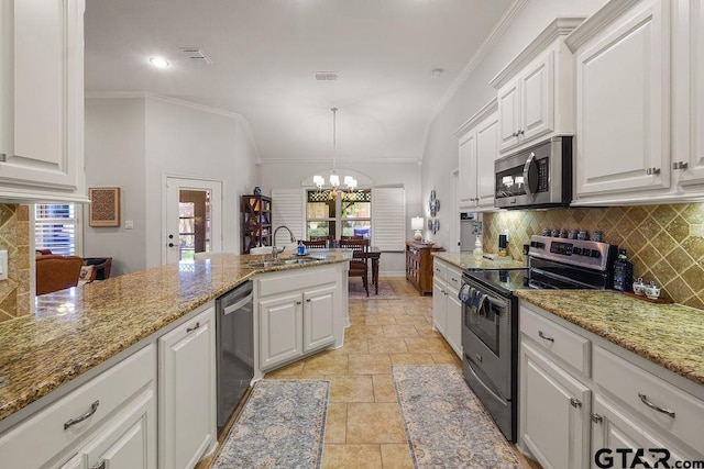 4133 Colina Trl, Tyler, TX 75707 - kitchen with appliances with stainless steel finishes, decorative backsplash, a chandelier, white cabinets, and crown molding
