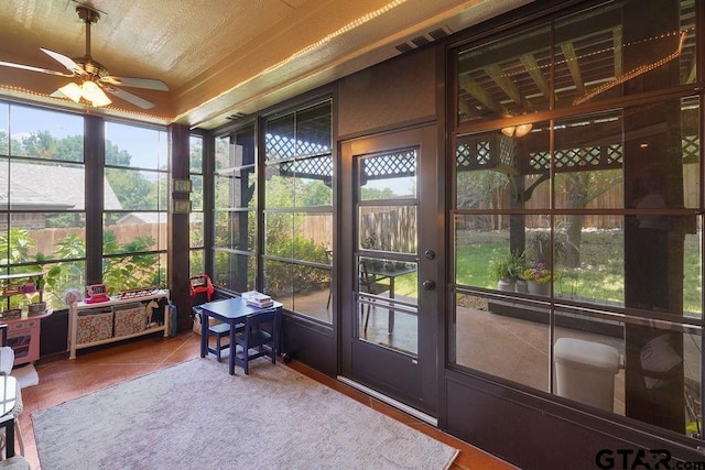 4133 Colina Trl, Tyler, TX 75707 - sunroom / solarium featuring ceiling fan, healthy amount of natural light, and tile patterned floors