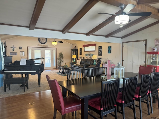 dining space with dark hardwood / wood-style flooring, vaulted ceiling with beams, and ceiling fan