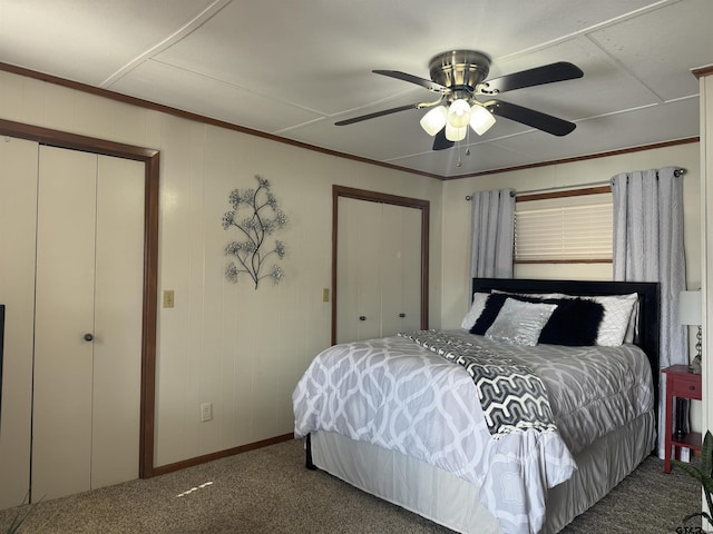 bedroom with dark colored carpet, ornamental molding, and ceiling fan