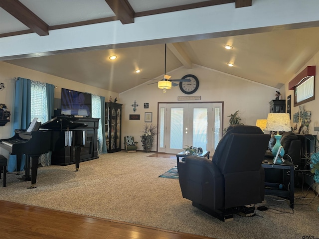 living room featuring vaulted ceiling with beams, hardwood / wood-style flooring, and french doors